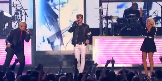 Morten on stage at the Billboard Music Awards, with Pitbull and Christina Aguilera